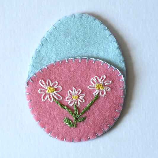 Floral hand embroidered reuseable Easter egg pouch made from 100% wool felt.