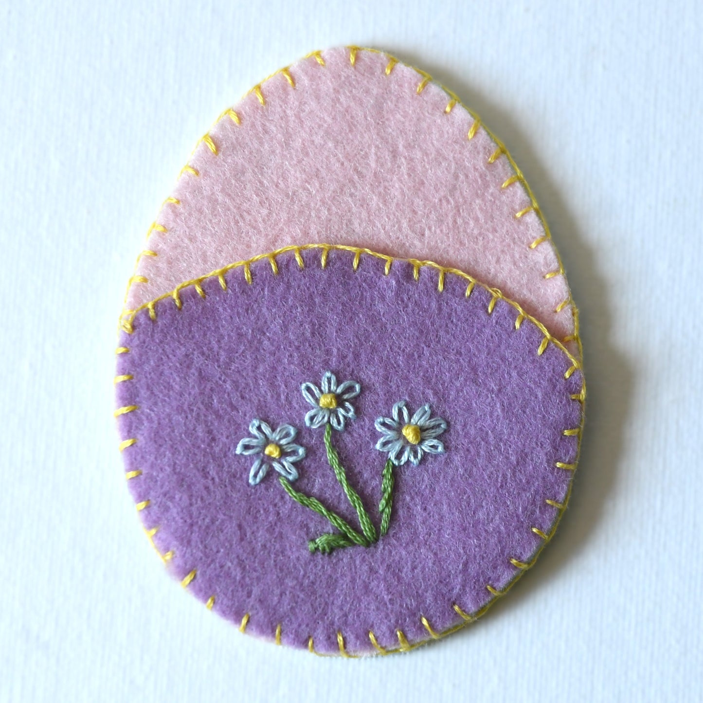 Floral hand embroidered reuseable Easter egg pouch made from 100% wool felt.