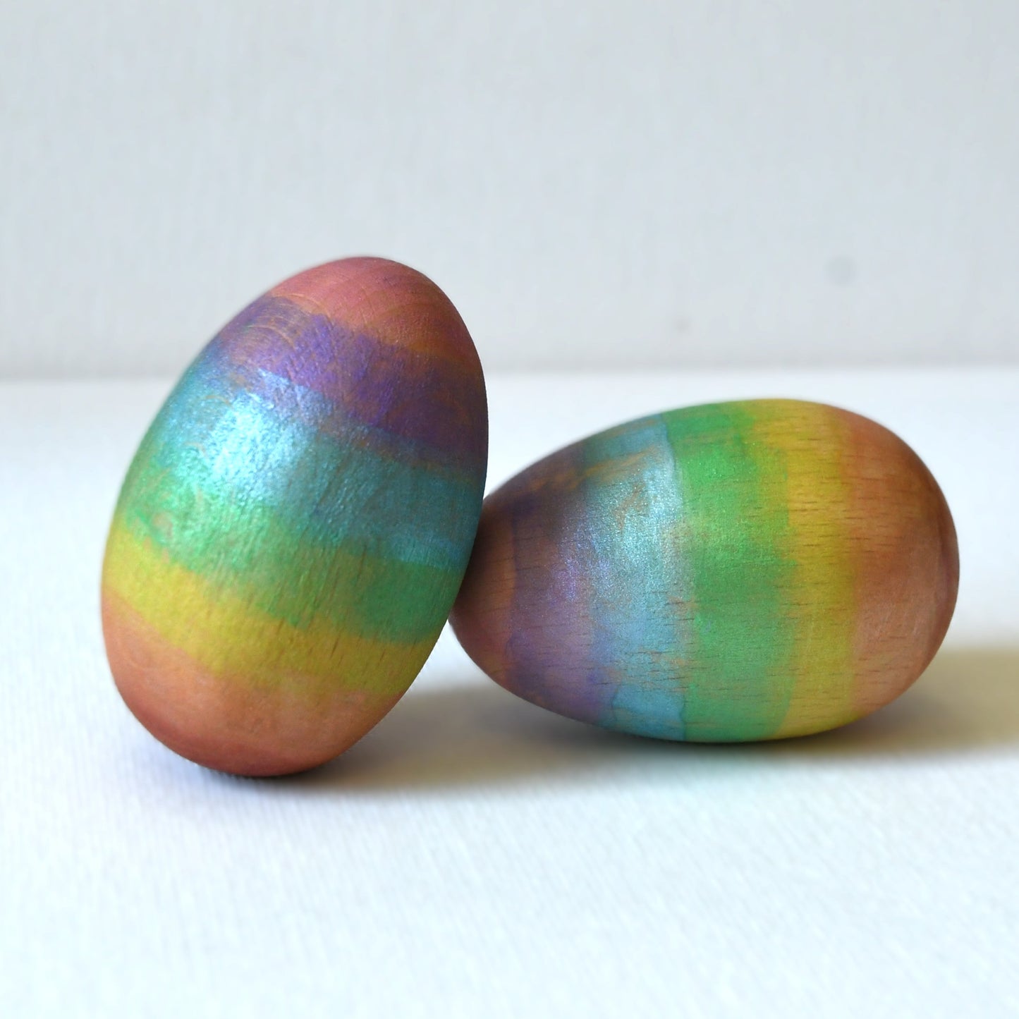 Rainbow wooden musical Easter egg maraca shaker.