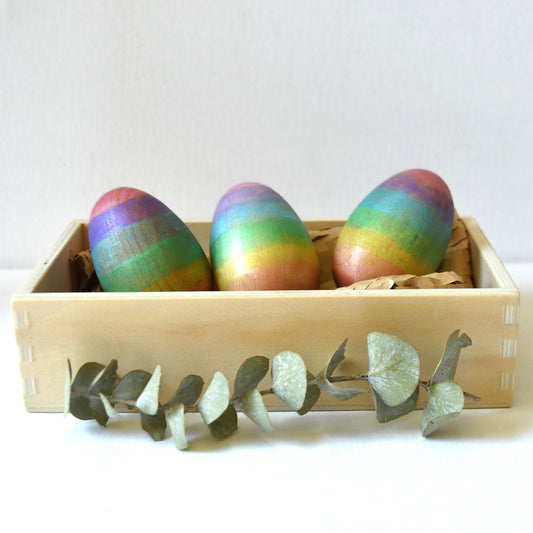 Set of rainbow wooden musical Easter egg maraca shakers.