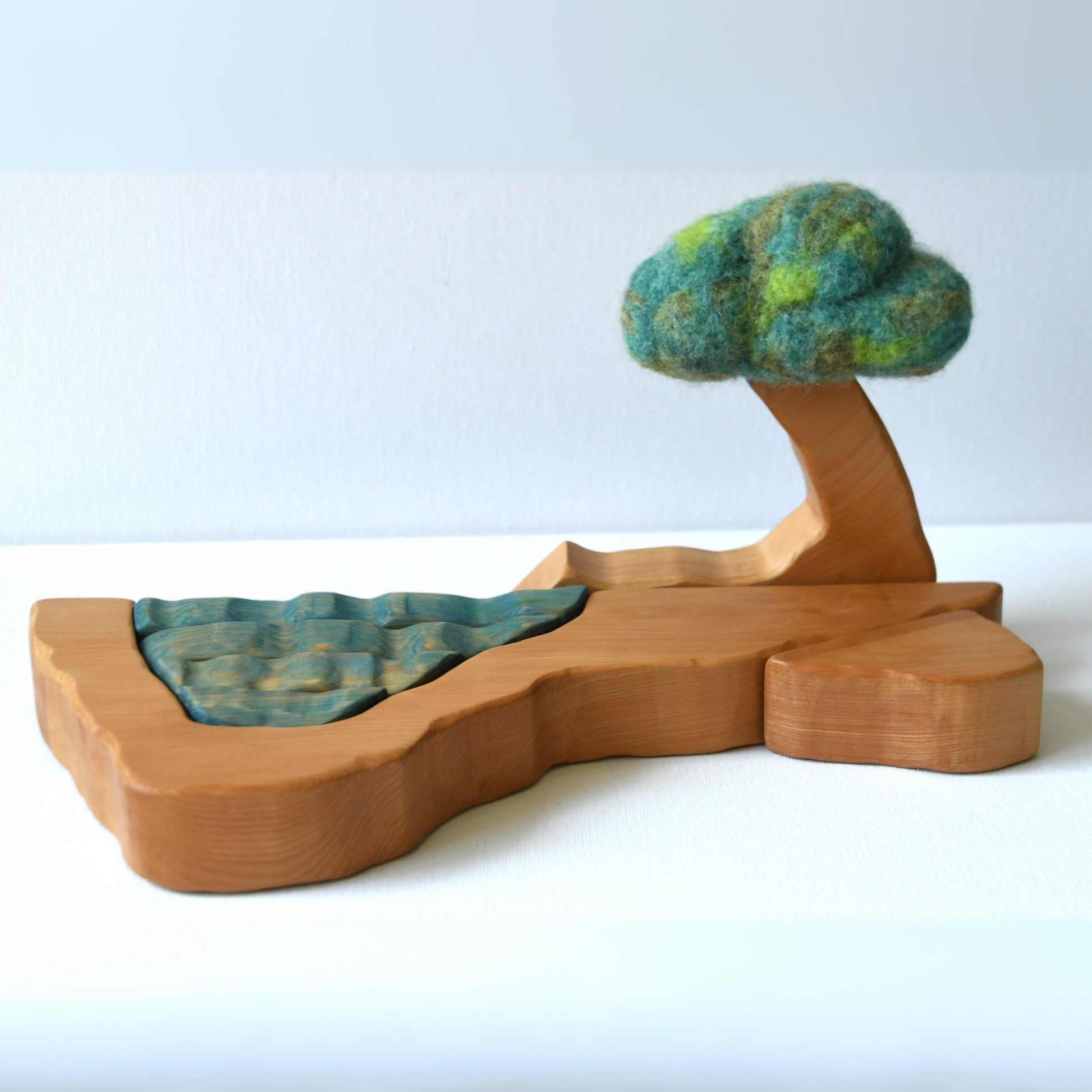 Wooden cave stacker toy with waterfall pond and felt bush