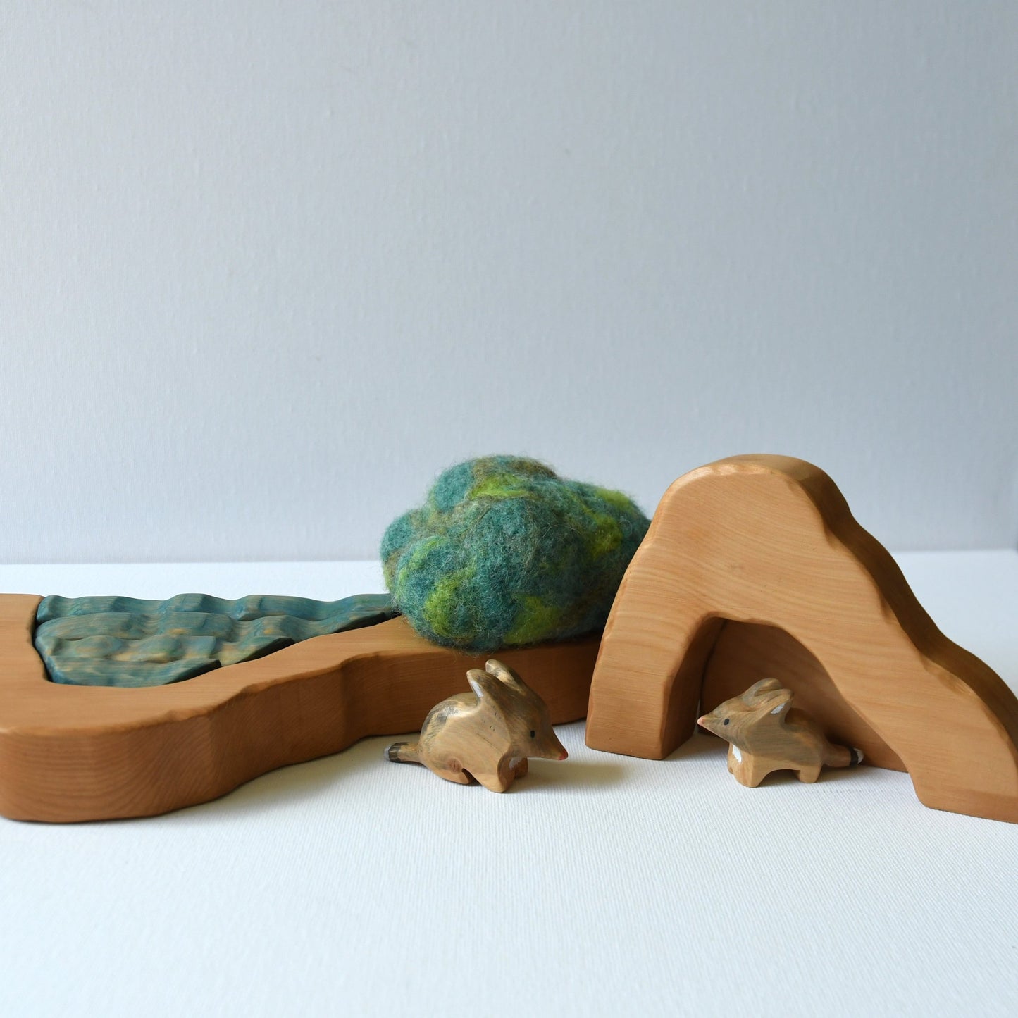 Wooden cave stacker toy with waterfall pond and felt bush