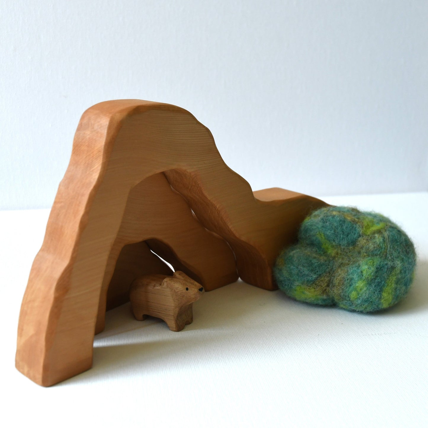 Wooden cave stacker toy with waterfall pond and felt bush