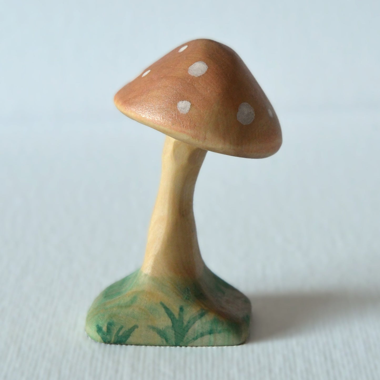 Wooden orange mushroom toy and fairy garden decoration.