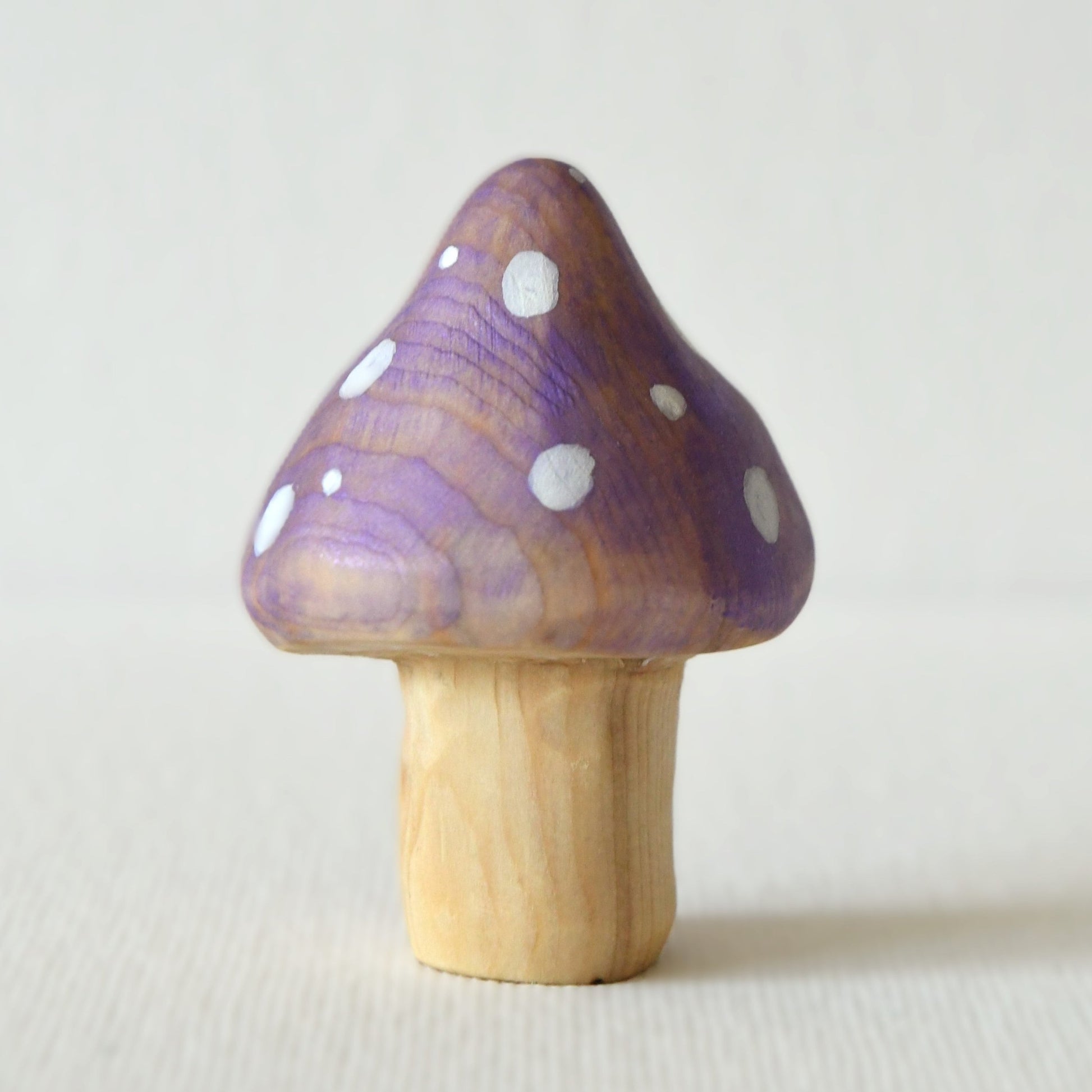 Wooden purple mushroom toy and fairy garden decoration.