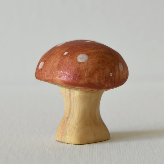 Wooden red mushroom toy and fairy garden decoration.