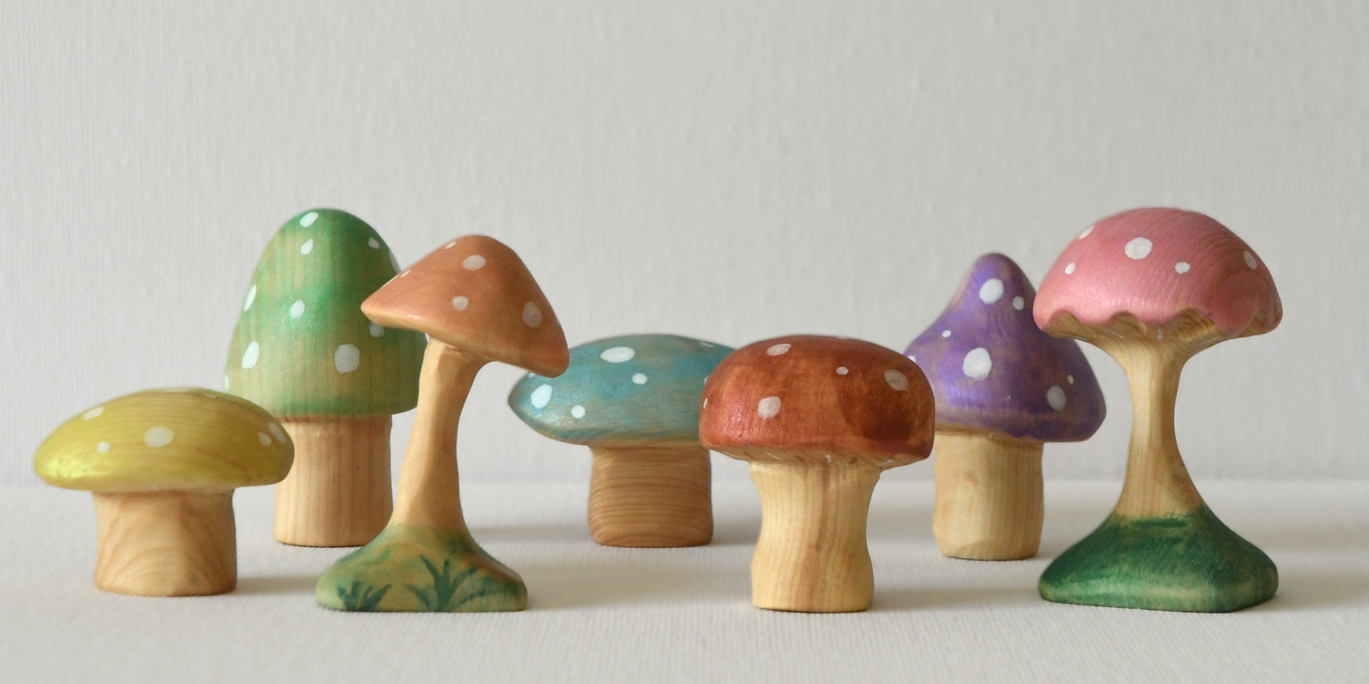 Wooden magical rainbow mushroom toys and fairy garden decorations.