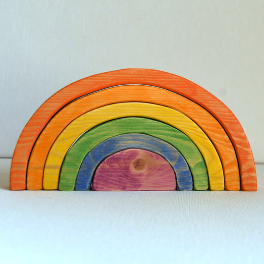 Waldorf inspired wooden rainbow stacking toy handcrafted in Australia from Tasmanian hardwood with certified toy-safe wood stains and natural oil sealer.