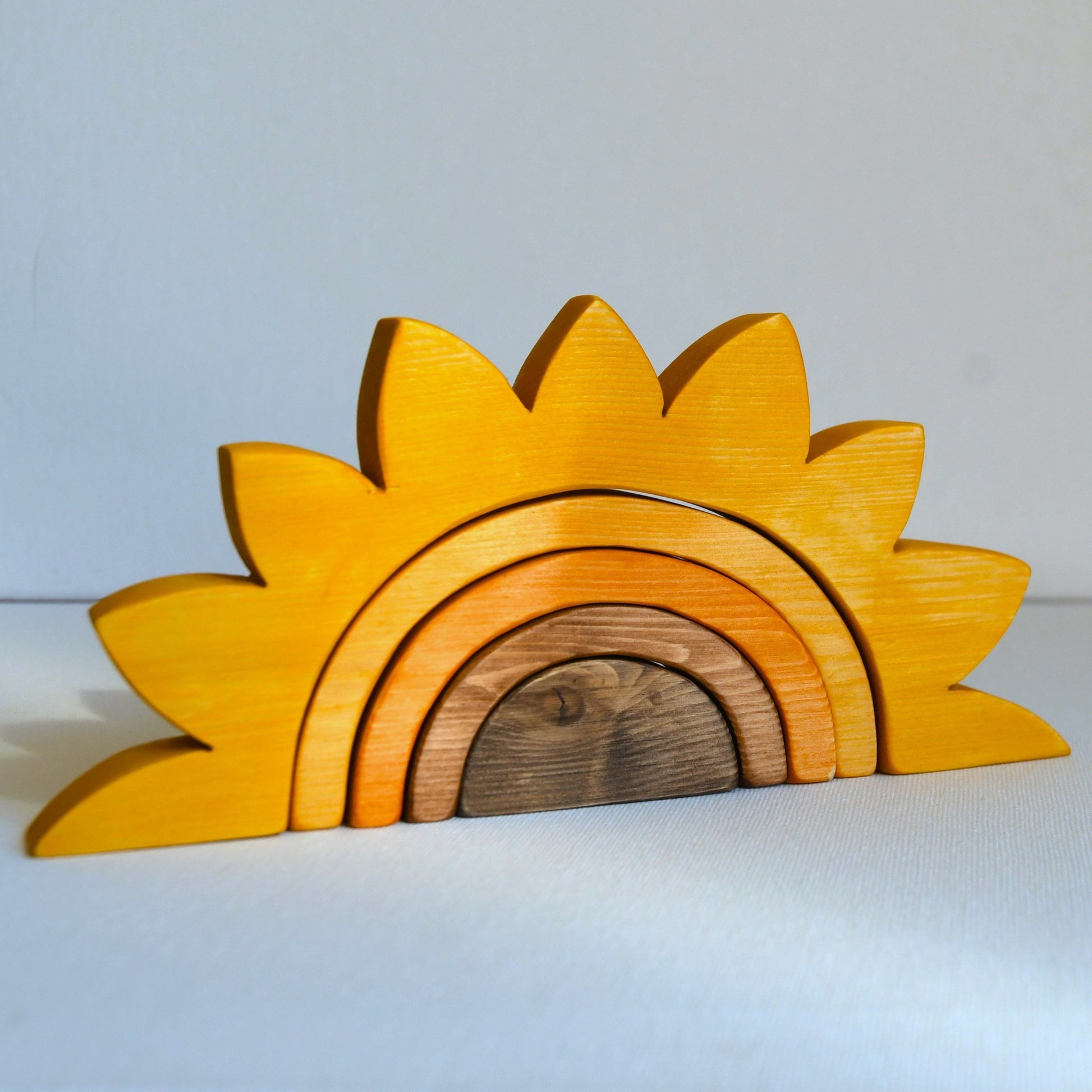 Waldorf inspired wooden sunflower stacking toy handcrafted in Australia from Tasmanian hardwood with certified toy-safe wood stains and natural oil sealer.