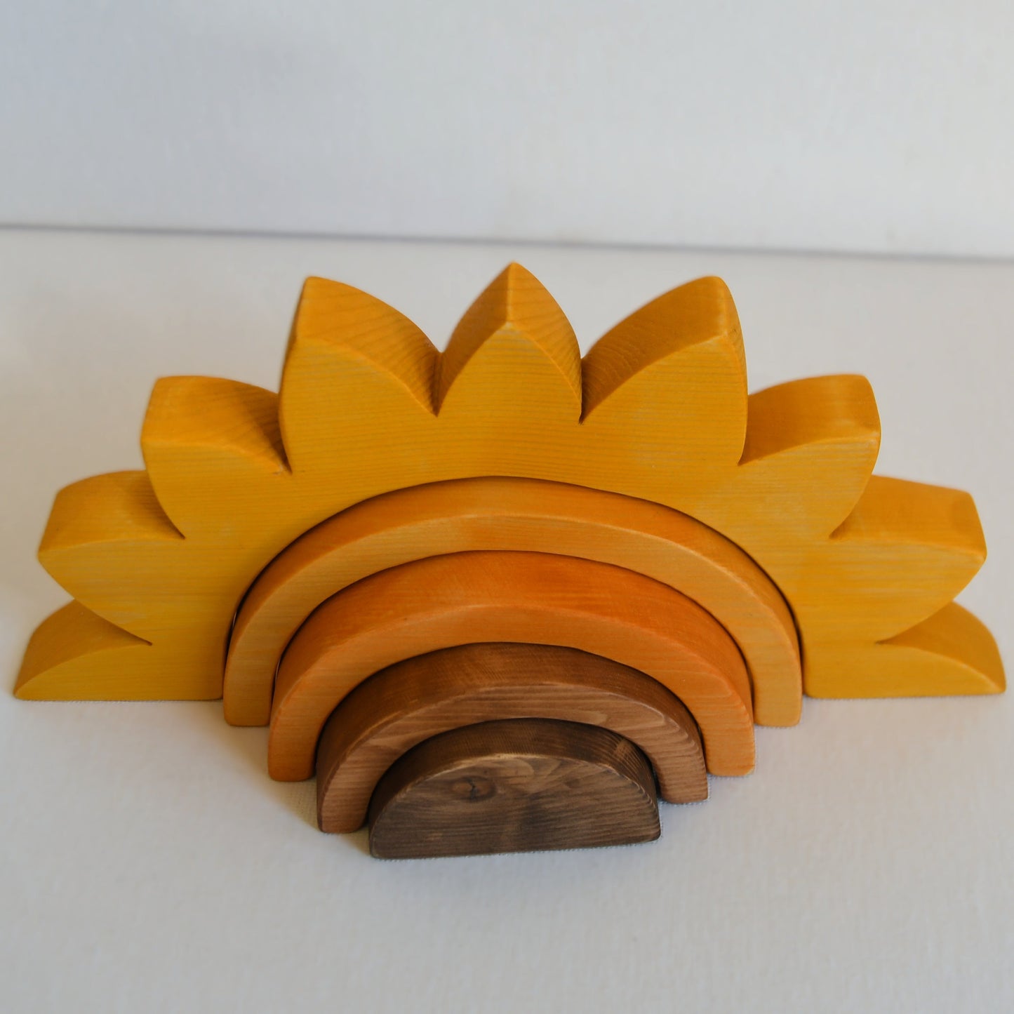 Waldorf inspired wooden sunflower stacking toy handcrafted in Australia from Tasmanian hardwood with certified toy-safe wood stains and natural oil sealer.